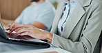 Typing, laptop and hands of businesswoman at seminar in office for finance planning with company budget. Tech, meeting and financial advisor with computer for investment information in workplace.