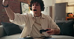 Frustrated, man or gamer with headset on sofa for esport, competitive challenge or bad play in home. Mad, male person or gaming with mic, controller or console on couch for player mistake in house