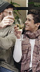 Wine, conversation and couple outdoor at restaurant for date on holiday with bonding, care or marriage. Happy, cheers and man with woman for drinking alcohol beverage on vacation together at cafe.