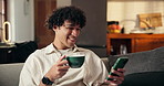 Home, coffee and happy man on couch, smartphone for social media and message to contact. Apartment, espresso and person with funny meme, relax and cellphone for online reading and website for humor