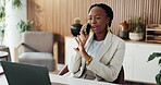 Laptop, woman and smile with phone call in office for guest list update, venue sourcing and info. Event planner, black person and mobile chat with supplier for reservation booking or client feedback