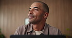 Thinking, employee and man with laptop, office and research for campaign on website and copywriting. Online, email marketing and person with technology for article, reflection and happy with project