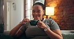 Thinking, calm and black woman with coffee on sofa for resting, wellness and reflection on weekend. Home, happy and person on couch with beverage, drink and aroma for relax, thoughtful and comfort