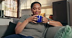 Happy, smell and black woman with coffee on sofa for resting, wellness and reflection on weekend. Home, thinking and person on couch with beverage, drink and tea for calm, thoughtful and relax