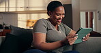 Tablet, scroll and smile with black woman on sofa for ebook subscription, relax and contact. Digital reading app, online blog and communication with person in living room of home for weekend break