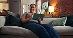 Tablet, reading and smile with black woman on sofa for ebook subscription, relax and contact. Digital library app, online blog and communication with person in living room of home for weekend break