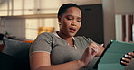 Tablet, search and reading with black woman on sofa for ebook subscription, relax and contact. Digital, online drama blog and communication with person in living room of home for weekend break