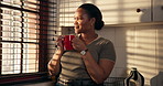 Thinking, kitchen and black woman with coffee in morning for wellness, start day and reflection on weekend. Home, happy and person by window with beverage, drink and tea for calm, peace and relax