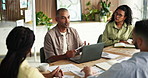 Creative, laptop and man with business people in meeting for ad campaign, planning and project. Teamwork, talking and workers with research statistics for marketing report, website traffic and info