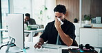 Man, flu and blowing nose in office with toilet paper, computer and sinus infection at marketing agency. Coworking, person and allergy in advertising company with tissue, virus symptoms and desktop.