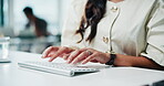 Typing, review or hands in office with keyboard, draft edit or source feedback for article update. Journalist, coworking or woman with tech, blog fact check or industry research for publication.
