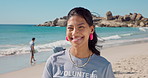 Happy, woman and face of volunteer on beach for recycling, community service or charity work. Smile, cleaning and portrait of female ngo employee by ocean for earth day with seaside conservation.