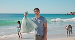 Beach, recycling and man with trash, face and smile for community service and cleaning with friends. Outdoor, waste management and people with plastic bag, laughing and social responsibility at sea