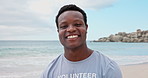 Happy, black man and face of volunteer on beach for recycling, community service or charity work. Smile, cleaning and portrait of African ngo employee by ocean for earth day with seaside conservation