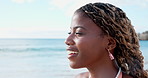 Happy, breathe and black woman at beach to relax for wellness, fresh air and reflection on weekend. Nature, thinking and person with calm by ocean for inspiration, memory and thoughtful on holiday