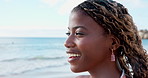 Thinking, breathe and black woman at beach to relax for wellness, fresh air and reflection on weekend. Nature, happy and person with calm by ocean for inspiration, memory and thoughtful on holiday