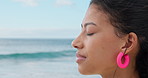 Relax, breathe and woman at beach with calm for wellness, fresh air and reflection on weekend. Nature, space and person by ocean for inspiration, peace and stress relief on holiday, vacation or break