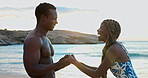 Happy, couple and holding hands on trip, beach and conversation on summer vacation, love and romance. Outdoor, black man and affection for woman on holiday, laughing and joke in nature and bonding