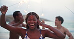Dance, sparkler and face of woman at beach for party celebration, summer vacation and freedom. New years event, excited and seaside holiday with people outdoor for happiness and social gathering