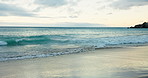 Empty, beach and tropical island for vacation, waves and getaway trip for adventure. Ocean, splash and coastline for summer holiday, sunset or journey for weekend break or tourism destination in Bali