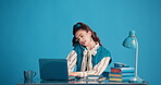 Phone call, notebook and businesswoman with laptop in studio, talking and typing reminder for schedule. Writing notes, speaking and person with tech for planning, project agenda and blue background