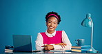 Happy, laptop and face of businesswoman in studio with research for creative project with books. Smile, computer and portrait of female magazine editor with pride for publishing by blue background.