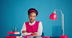 Smile, laptop and face of businesswoman in studio with research for creative project with books. Happy, computer and portrait of female magazine editor with pride for publishing by blue background.