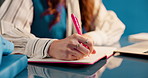 Business woman, writing and notebook for schedule, productivity and project management in studio. Aesthetic, journalist and employee with report, research and creative publisher on blue background