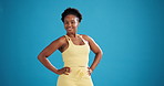 Happy, black woman and face with fitness confidence in studio for power on a blue background. Portrait, female person or active model with smile, strength or power for health and wellness on space