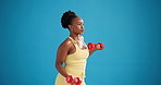 Studio, black woman and exercise with dumbbells for fitness, workout or health on blue background. Curl, weightlifting and strength training with person for bicep muscle, power and mockup space
