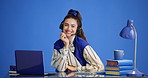 Call center, headset and face of businesswoman in studio with laptop for communication, crm or contact. Computer, mic and female technical support agent with online consultation by blue background.
