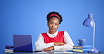 Face, writer and black woman in studio, smile and creative project for startup on blue background. Copywriting, professional and African person at desk, pc and career ambition for journalist or relax