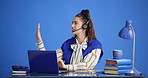 Call center, headset and businesswoman in studio with laptop for communication, crm or contact us. Computer, mic and female technical support agent with online consultation by blue background.
