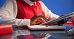 Woman, hands and research with tablet in studio for schedule planning on a blue background. Closeup, female person or employee scrolling with technology or book for project agenda, tasks or deadline