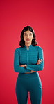 Woman, face and fitness with confidence in studio for workout on a blue background. Portrait, female person or active model with arms crossed, strength or power for health and wellness on space