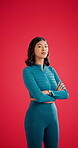 Face, athlete and woman with arms crossed, studio and confident for fitness goals or red background. Mockup space, serious and person with pride after exercise, training and wellness in Colombia