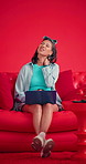 Studio, girl and laptop with neck pain on couch for poor posture, elearning stress or discomfort. Mockup space, gen z student or tech with muscle tension on red background for exam anxiety or massage