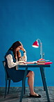 Thinking, student and woman with stress, studio and study with notebook for assignment and exhausted. Blue background, mockup space and person with anxiety for test, education and wonder with burnout