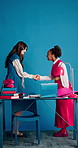 Handshake, introduction or women in office with smile, space or collaboration in b2b deal. Shaking hands, greeting or employees in creative studio with tech, agreement or opportunity in partnership.