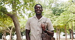 Face, black man and student with smile at park for travel, education and college scholarship. Portrait, male person and low angle with backpack, morning commute and studying opportunity for knowledge