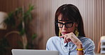 Creative, woman and thinking in office with laptop, review project and research for digital marketing. Mature person, glasses and check campaign in advertising agency with computer, plan or browsing.