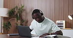 Documents, headset and laptop with black man in call center for assistance, help or online support. Computer, customer service and reading paperwork with African employee in office for solution