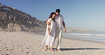 Love, walk and couple hug at beach for care, support or connection with happy partner on vacation. Embrace, man and woman travel by ocean for summer holiday, trust or romance for healthy relationship