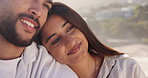 People, smile and couple on break, beach and relax on summer holiday, love and romance with partner. Outdoor, man and embrace with woman on vacation, happiness and commitment for relationship at sea