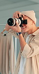 Happy man, photographer and fashion with camera for photoshoot, production or lighting in studio. Male person, photography and smile with equipment or lens for clothing magazine, catalog or media