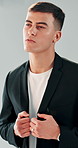 Man, model and fashion in studio for photoshoot, confidence or outfit for style on white background. Person, photography and trendy suit with pride, creative career or clothes collection for magazine