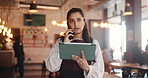 Waitress, talk or phone call in diner with tablet, booking website or digital app for online order. Bokeh, woman and conversation in restaurant with tech, contact or reservation for customer service.