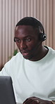 Call center, headset and black man with laptop, office and talking with contact and troubleshooting. Tech support, consultation and person with paperwork for IT solution, help and problem solving