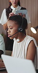 Woman, consultant or talking with headset in call center agency for online advice or help in office. Female person, advisor or agent speaking with mic on computer for virtual assistance in workplace