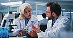 Man, woman and scientist with tablet for team at lab, discussion and review notes for medical research. People, tech and feedback with checklist on app, pharmaceutical study or vaccine development